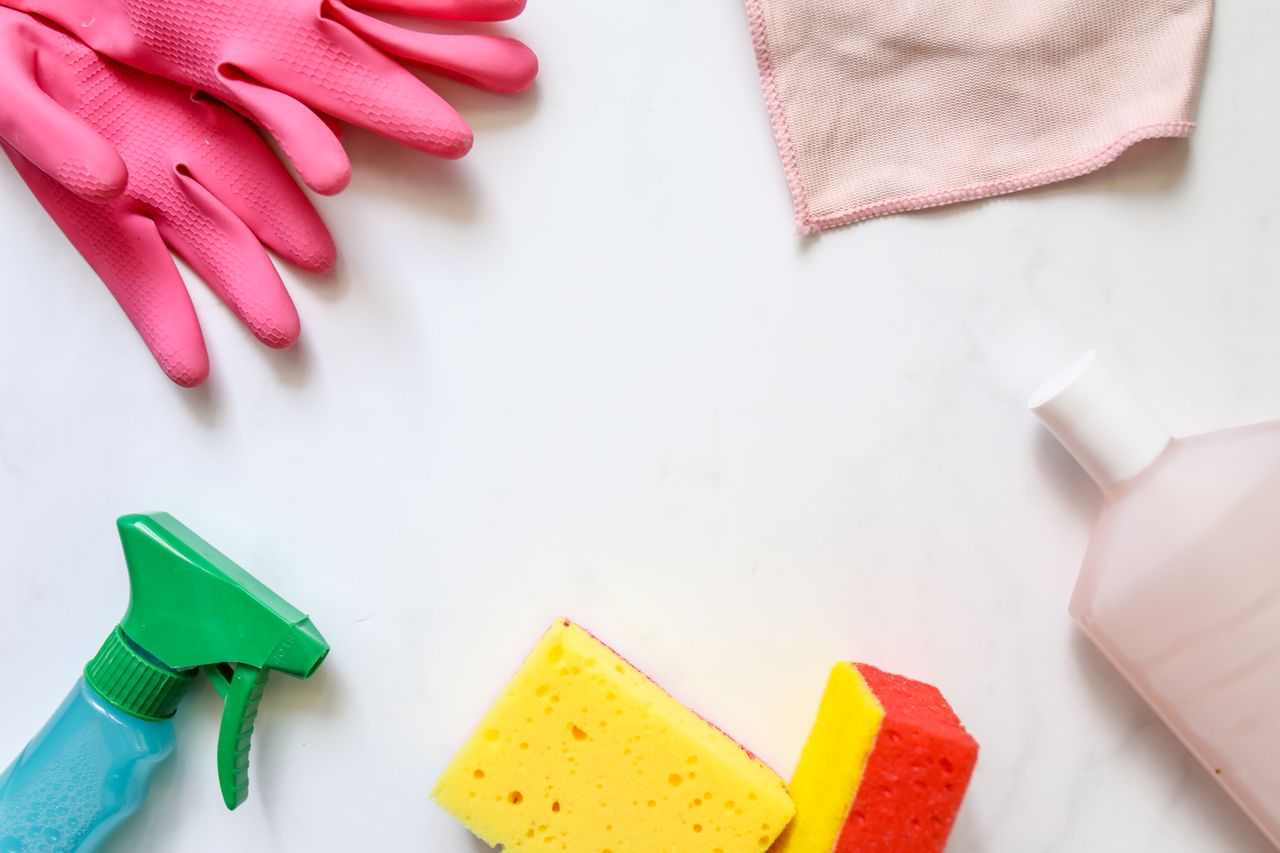 Portfolio A flat lay of assorted cleaning supplies, perfect for housekeeping themes.